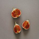 sliced tomato on gray surface